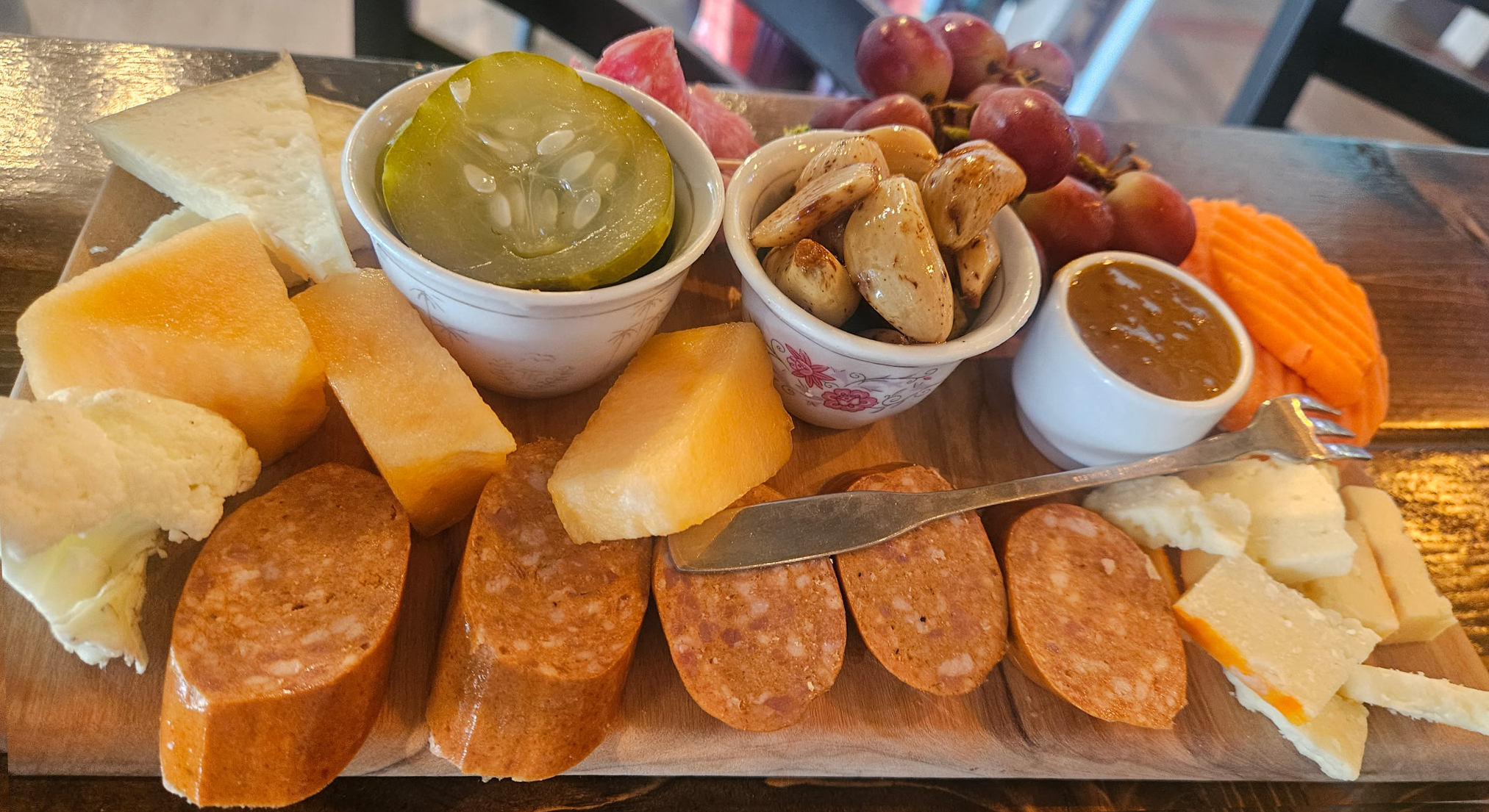 Overhead view of The Continental Indulgence charcuterie board at The Ozark Fork & Cork